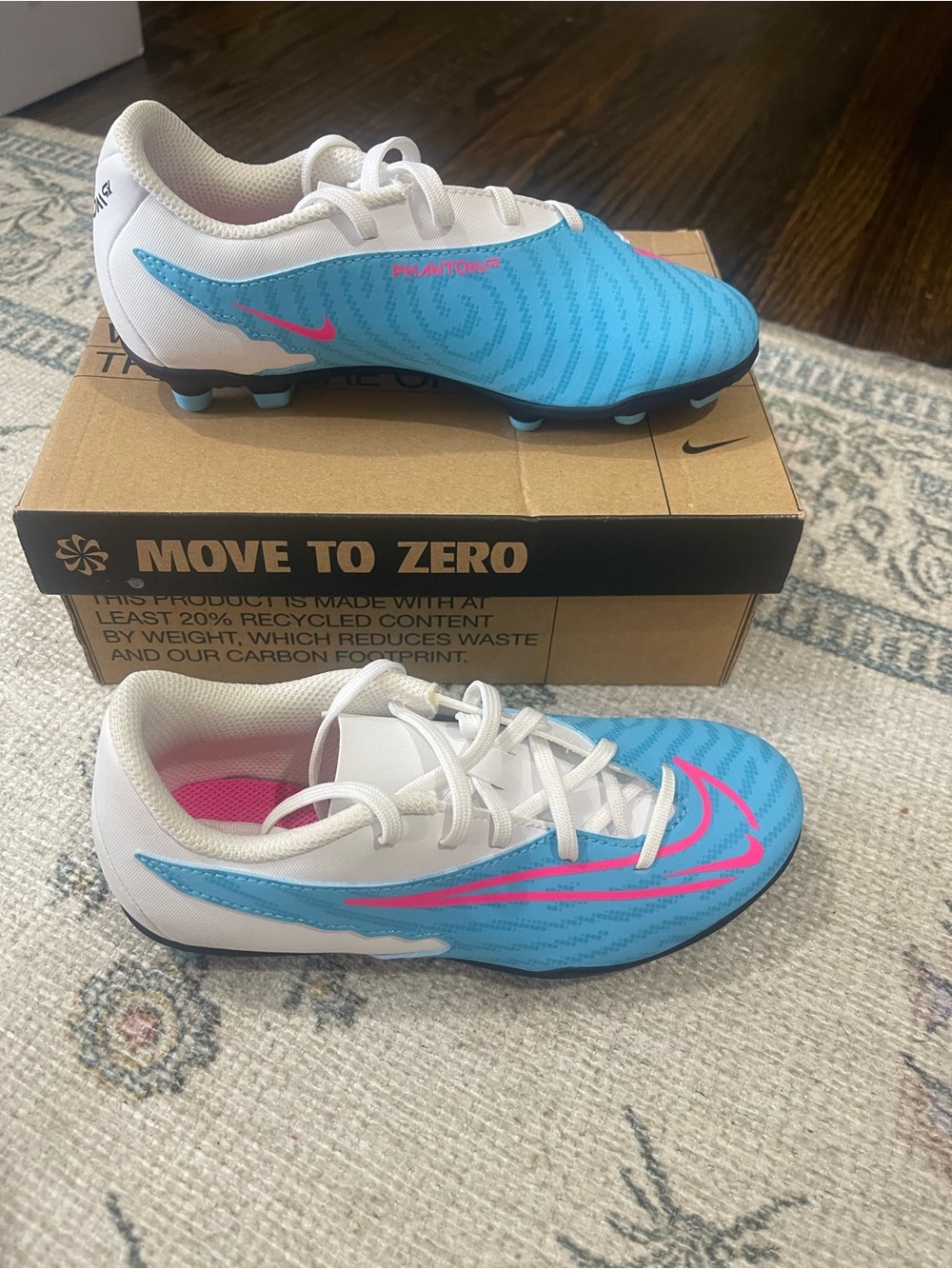 Nike Youth Blue and White Soccer Cleats with Pink Swoosh